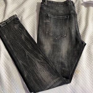 Black jeans with black lightning stripe down the side